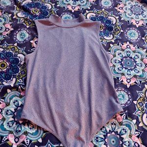 grey half way turtle neck buttons at the bottem